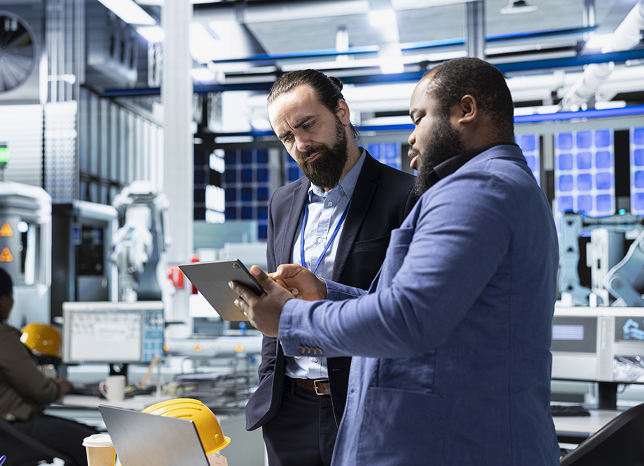 multiethnic-specialists-engineers-doing-teamwork-modern-production-line